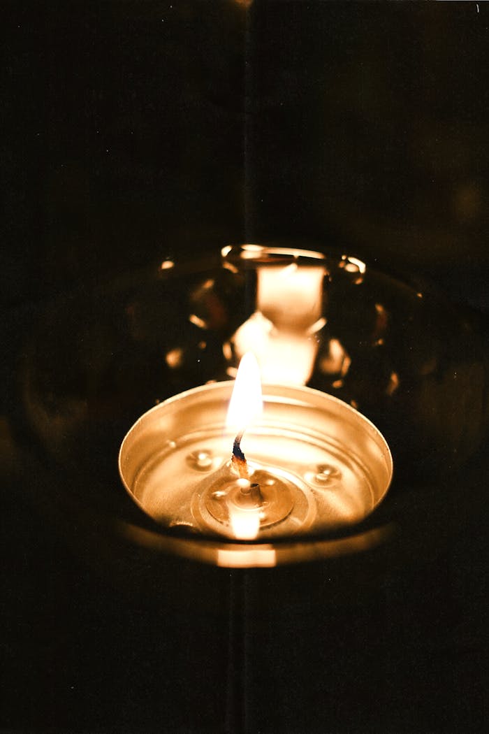 TabImports: Over 30 Years of Excellence in Paraffin Wax and Industrial Chemicals A beautiful close-up of a candle flame in a holder, creating a warm and serene atmosphere.